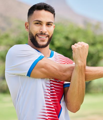 Happy male stretching his shoulder